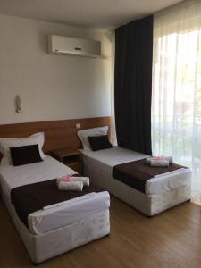 Postel nebo postele na pokoji v ubytování Dreams Family Hotel
