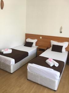 Postel nebo postele na pokoji v ubytování Dreams Family Hotel
