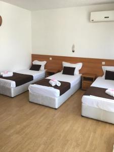 Postel nebo postele na pokoji v ubytování Dreams Family Hotel