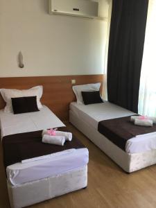 Postel nebo postele na pokoji v ubytování Dreams Family Hotel