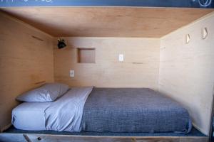 a bedroom with a bed in a small room at PodShare Hollywood in Los Angeles