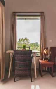Posezení v ubytování Umah Tikari Guesthouse