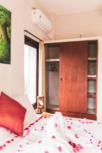 Postel nebo postele na pokoji v ubytování Umah Tikari Guesthouse
