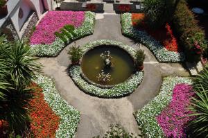 an overhead view of a flower garden with a pond at Hotel Parsifal - Antico Convento del 1288 in Ravello