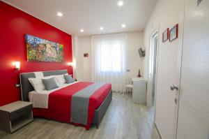 Кровать или кровати в номере Gustarosso Rooms