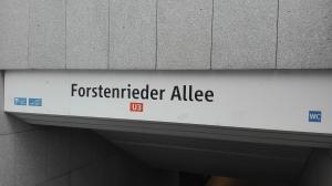 a sign that reads fürkensker allee on a building at apartment near underground station in Munich