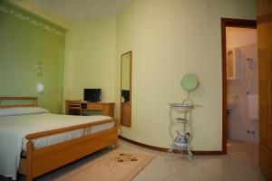 Letto o letti in una camera di Hotel Centrale di Paolo e Cinzia
