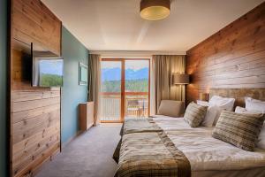 Postel nebo postele na pokoji v ubytování Katarino SPA Hotel