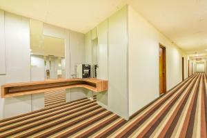 a room with a hallway with striped flooring at Northern Lodge Hotel in Sungai Petani