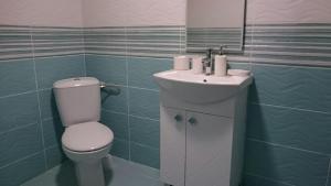 a bathroom with a toilet and a sink at Guesthouse Dida in Sapareva Banya
