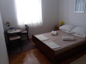Postel nebo postele na pokoji v ubytování Apartman Nona
