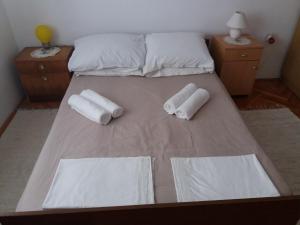 Postel nebo postele na pokoji v ubytování Apartman Nona