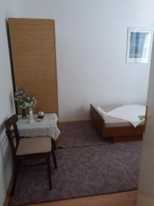Postel nebo postele na pokoji v ubytování Apartman Nona