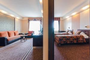 Postel nebo postele na pokoji v ubytování Hunguest Hotel Apollo