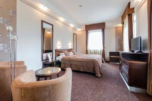 TV a/nebo společenská místnost v ubytování Hunguest Hotel Apollo