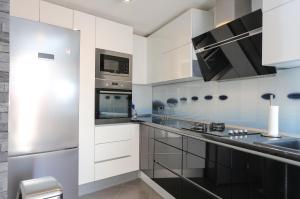 Kuchyň nebo kuchyňský kout v ubytování Apartment Tonka