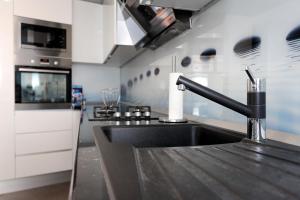 Kuchyň nebo kuchyňský kout v ubytování Apartment Tonka
