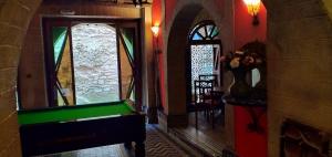 a hallway with a pool table in a room at Dar Ayour appartements in Essaouira