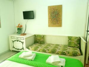 Postel nebo postele na pokoji v ubytování B&B Platamon