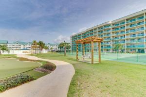 a park in front of a building with a playground at Plantation Dunes in Gulf Shores