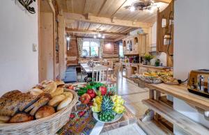 a kitchen with a table filled with lots of food at Pokoje Gościnne Światłomir in Zakopane