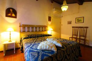 a bedroom with a bed with two pillows on it at Villa Gioiosa in Monte San Savino +31 photos