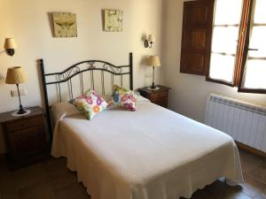 a bedroom with a bed with two pillows on it at Casa Collao 24 in Sierra