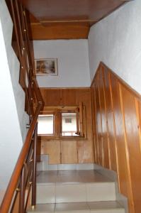 a staircase in a house with a window at Baba Dora Guesthouse in Dobrinishte