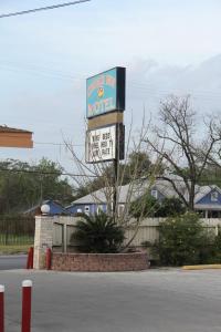 a motel sign on the side of a street at Choice Inn San Antonio in San Antonio