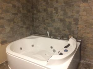 a white bath tub sitting in a bathroom at Abbazia dei Gesuiti in Bari