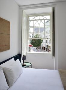 Postel nebo postele na pokoji v ubytování Spot Apartments Casa Januario