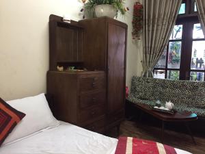 Postel nebo postele na pokoji v ubytování Villa Du lịch HUY HOÀNG