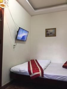 Postel nebo postele na pokoji v ubytování Villa Du lịch HUY HOÀNG