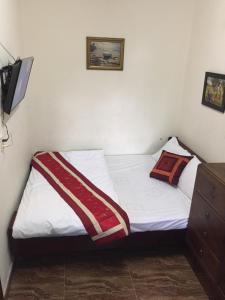 Postel nebo postele na pokoji v ubytování Villa Du lịch HUY HOÀNG