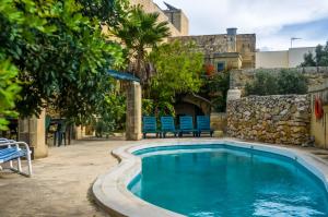 The swimming pool at or close to "Steves Villas" Villa ta Rosi