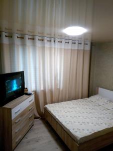 Кровать или кровати в номере VIP Квартира