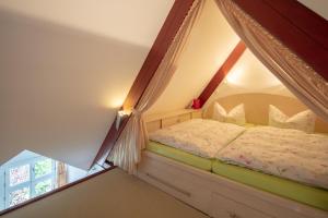 Postel nebo postele na pokoji v ubytování Gäste-Maisonette Martinus
