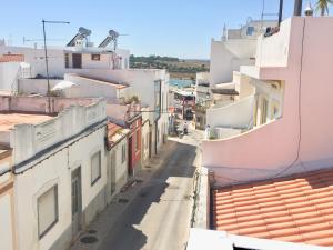 a view of an alley between buildings at Alvor Terrace Villa in Alvor