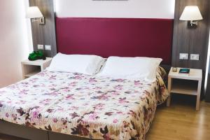 Posteľ alebo postele v izbe v ubytovaní Hotel Il Giardino