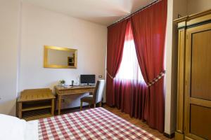 Posteľ alebo postele v izbe v ubytovaní Hotel Il Giardino
