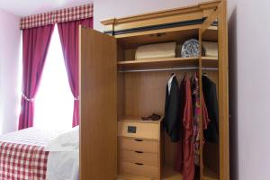 Posteľ alebo postele v izbe v ubytovaní Hotel Il Giardino