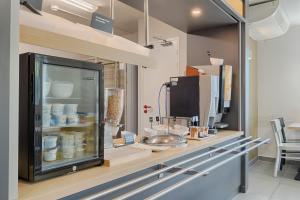 a display case in a store with food in it at B&B HOTEL Aix-en-Provence Pont de l'Arc in Aix-en-Provence