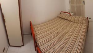 เตียงในห้องที่ Casa Giummarra al primo piano