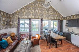 a living room with a couch and a table at Daftö Resort in Strömstad