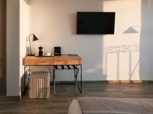 Televízia a/alebo spoločenská miestnosť v ubytovaní Hotel Boutique Balandret