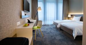 b_smart motel Landquart客房内的一张或多张床位