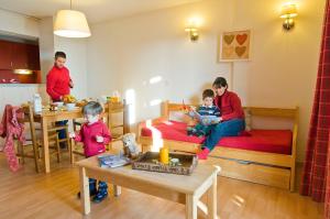 a group of children in a room with beds at R&eacute;sidence Go&eacute;lia Le Domaine de Castella in Font-Romeu