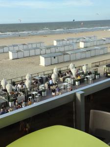a view of the beach from the top of a building at Zeedijk Appartement in Knokke-Heist
