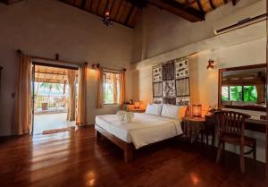 Ένα ή περισσότερα κρεβάτια σε δωμάτιο στο Koh Mak Cococape Resort