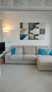 a living room with a white couch and a painting at Villa Sky with stunning view in Selca